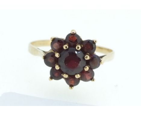 A 9 carat gold garnet cluster ring, size R/S