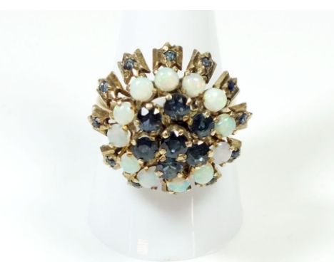 A 14 ct gold vintage dome top ring set sapphires and opals, size Q1/2