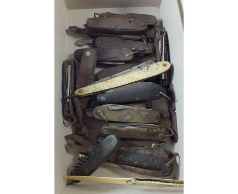A collection of folding multi-tool knives - approximately twenty in total