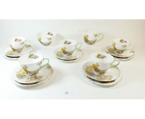 A Shelley tea service 'Heather' comprising jug, sugar, five cups and saucers and five tea plates