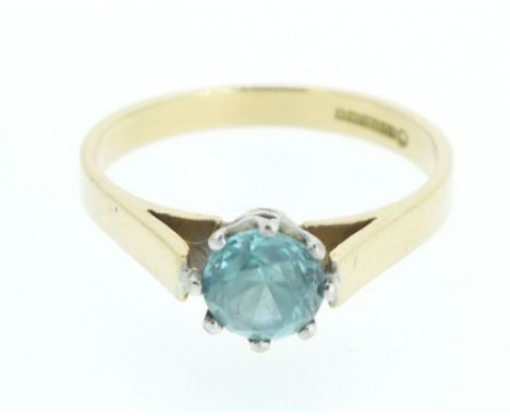 An 18ct gold ring set with blue topaz - size N.