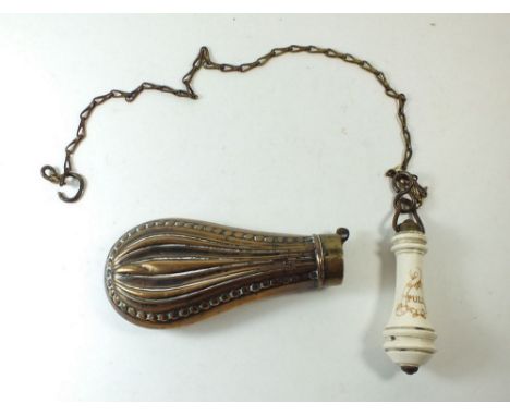 A Victorian ceramic toilet pull handle together with a brass powder flask