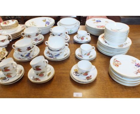 A Royal&nbsp; Worcester Evesham dinner service comprising:- eight dinner plates, eight breakfast plates, eight side plates, t