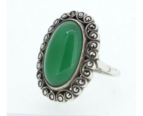 A silver and marcasite ring set green stone, Size L