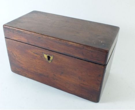 A mahogany tea caddy with two interior lidded compartments, 20cm wide