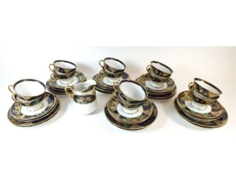 A Noritake black and gilt tea set comprising twelve cups and saucers, milk and twelve side plates