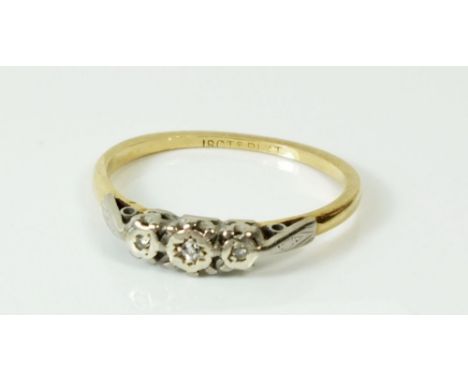 A 9ct gold ring illusion set three chip diamonds, size K/L