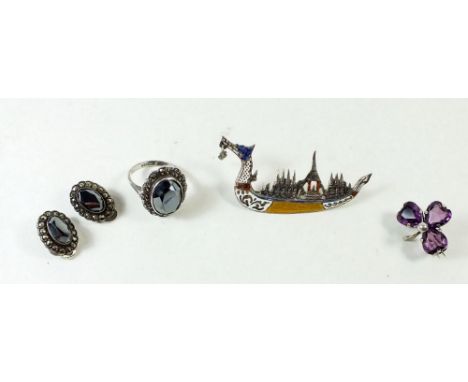A Charles Horner silver and purple paste shamrock brooch, a Siam silver and enamel boat form brooch and a pair of silver and 