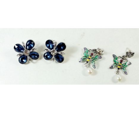 A pair of silver and plique a jour enamel butterfly earrings and a pair of white metal earrings set blue stones