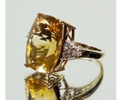 A 9 ct gold ring set citrine on triple diamond set shoulder, size N/O