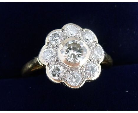 An 18 ct gold diamond set cluster ring, Size I/J