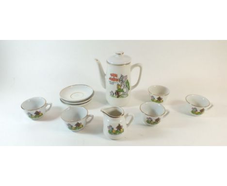 A Tom &amp; Jerry child's tea service comprising teapot, four cups, three saucers, milk jug and sugar bowl  