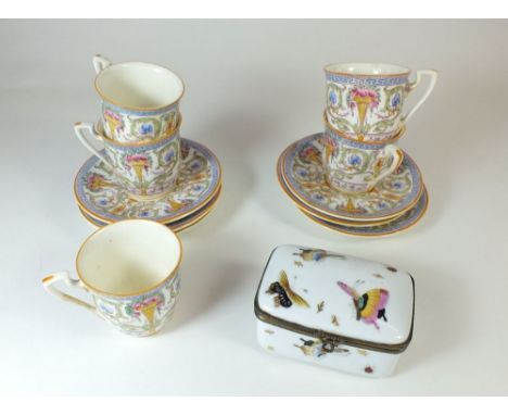 A Royal Worcester set of five coffee cups and saucers No 6981 and a porcelain box painted butterflies