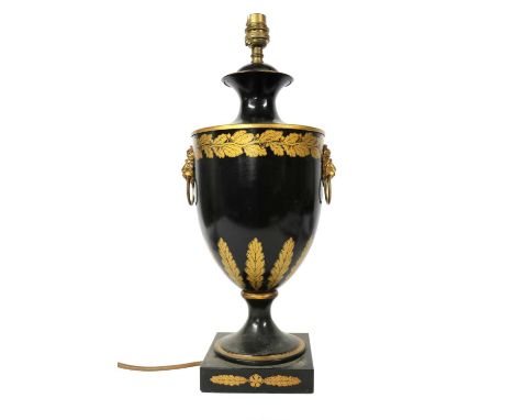 A black toleware table lamp, of Classical urn shape with gilt foliate decoration and lions mask ring handles, 47cm highCondit