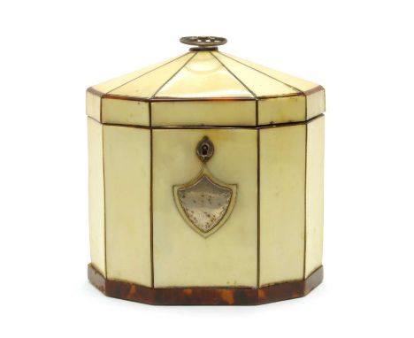 A George III ivory and tortoiseshell tea caddy, of elongated decagon shape, with silver mounts. 13.5cm long, 8.5cm deep, 15cm