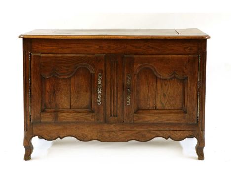 A 19th century French oak buffet sideboard, with panelled doors and sides. 135cm wide, 57cm deep, 954cm highCondition report: