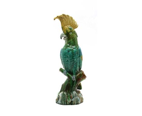 A majolica cockatoo parrot, probably continental, green and yellow glazes. 36cm highCondition report: Appears to be in good c