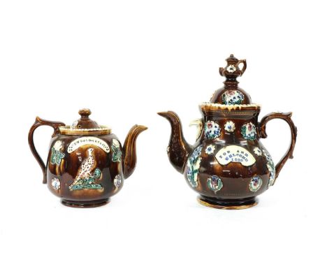 Two barge teapots and covers, the first of baluster shape with applied flowers and a panel impressed 'You are welcome 1899', 