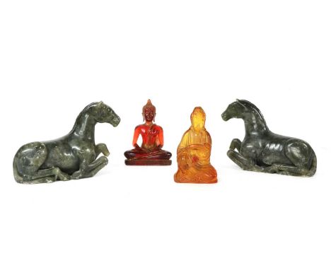 A pair of jade horses, 15cm high and two 'amber' Buddhas, 16 &amp; 15cm high (4)Condition report: Horses both with a broken f