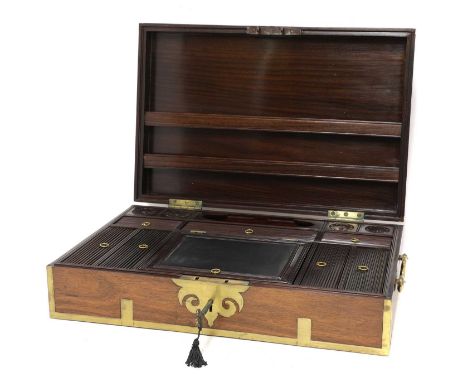 A large Indian padouk and brass-mounted writing box,  19th century, having a fitted interior with various compartments and a 
