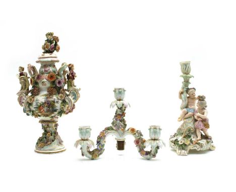 Two late 19th century German porcelain items, the first a Meissen figural candelabra with three branches, encrusted with flow