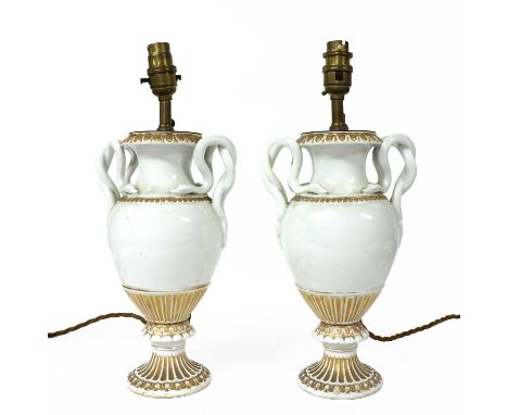 A pair of Meissen style vases, late 19th century, now table lamps, wtih entwined serpent handles and gilt details, crossed sw