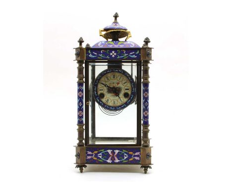 A cast four glass enamelled mantel clock, with an enamelled dial, with a mercury pendulum, 44.5cm highCondition report: Urn l