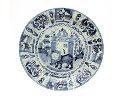An 18th century Delft blue and white plate, the centre painted with a stylised lion before an arch. 33.5cm diam.Condition rep