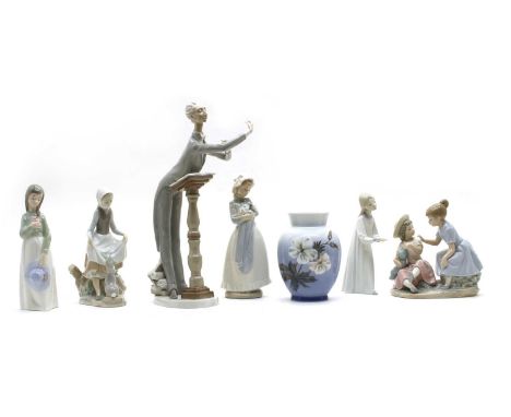 A collection of porcelain figures, to include a Royal Copenhagen Sleeping Cat, model 422, a Mink, designed by Jeanne Grut, mo