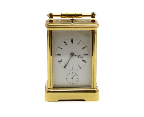 A French brass cased carriage clock, with alarm and repeat mechanisms, striking on a gong with white enamel dial and subsidia