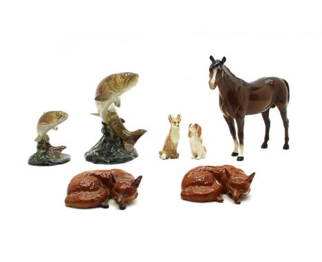 Six Beswick models, comprising: a horse, two leaping trout, 1032 + 1390, two curled up foxes, a spaniel, together with a fox 