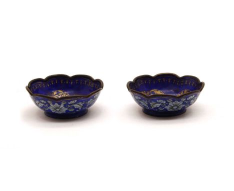 A pair of Chinese Canton enamel dishes or brush washers, probably late Qing dynasty, each with a lobed rim, painted and gilt 