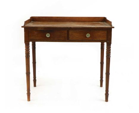 A Regency mahogany washstand, the gallery top above two frieze drawers on ring turned supports, 91cm wide, 52cm deep, 85cm hi