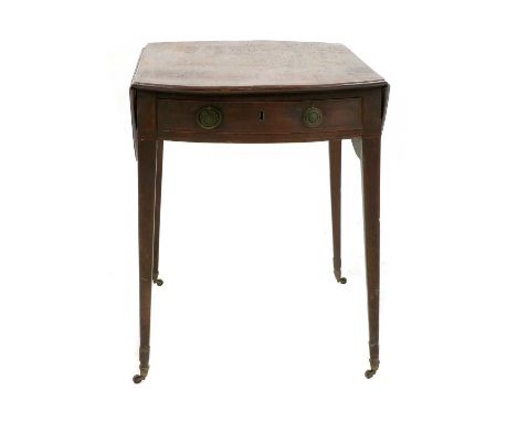 A George lll oval crossbanded mahogany Pembroke table with 2 flap top and end drawer on square taper legs with brass castors.