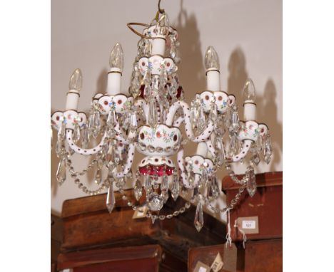 A Bohemian ruby and white overlay glass chandelier with enamelled decoration and nine lights hung glass ropes and drops, 24" 