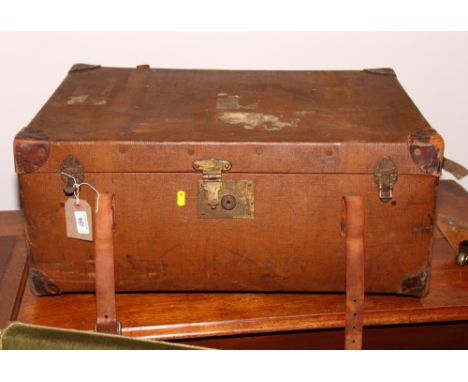 A brown canvas covered trunk