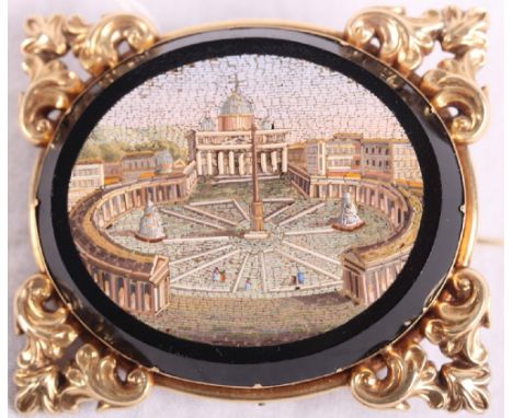 A 19th Century oval micro mosaic panel decorated view of St Peter's Square in ornate yellow metal brooch mount