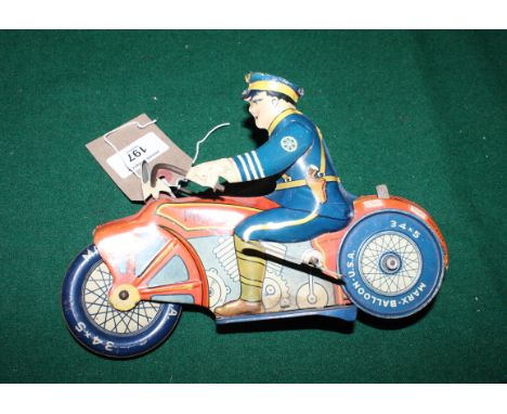 A Marx tin plate police motorcycle