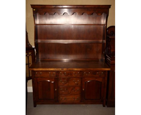 A Stuart Linford Georgian design elm dresser with two shelf open back, base fitted six drawers and two cupboards, 54" wide