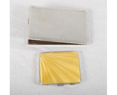 A silver cigarette case with engine turned decoration and a silver cigarette case with engine turned and yellow guilloché ena