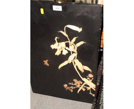 A 19th Century Japanese black lacquer panel inset carved ivory and bone figure of an eagle on a branch and two similar panels