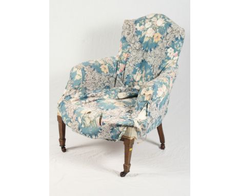 A late 19th Century tub shape occasional chair, button upholstered in a floral fabric, on turned and castored supports