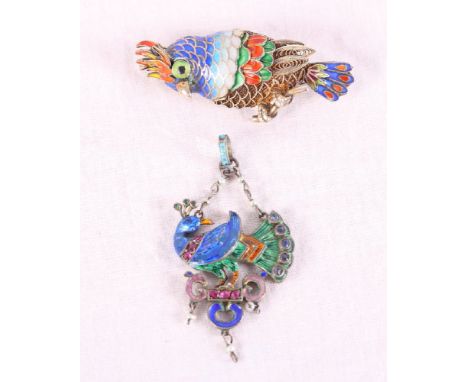 A Renaissance revival silver and enamel bird pendant and a Chinese silver gilt and enamelled parrot brooch