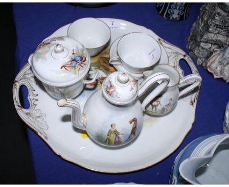 A late 19th Century Sèvres porcelain cabaret set decorated 18th Century ladies with gallants comprising a coffee pot, a sucri