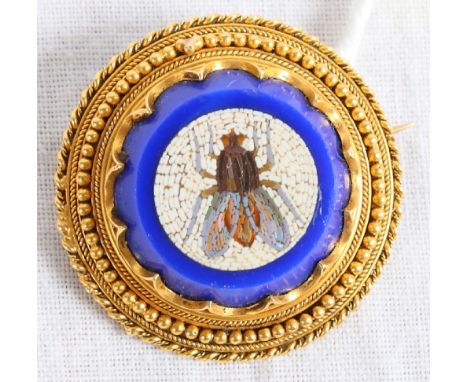 A 19th Century circular yellow metal brooch mounted with a micro mosaic panel decorated a fly