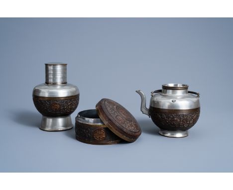 Full title: A Chinese pewter and carved coconut 'Shou' box and cover, a teapot and a tea caddy, Republic, 20th C.Description: