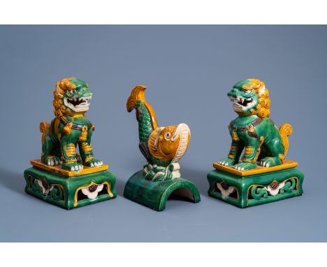 Full title: A Chinese sancai fish-form roof tile and two temple lions, 20th C.Description: H 30,5 - 28,5 cm (the tallest and 