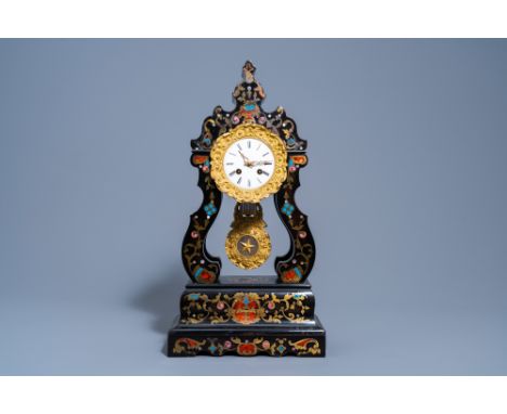 Full title: A French Historicism ebonised wood mother-of pearl, enamel, tortoiseshell and brass inlaid portico clock, 19th C.