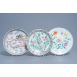 Three Chinese famille rose chargers with floral design and a dragon, 19th/20th C.
