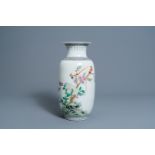 A Chinese famille rose vase with birds among blossoming branches, Republic, 20th C.